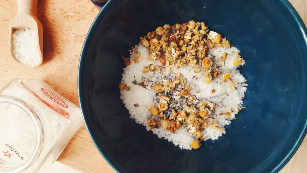 Soothing homemade sea salt bath for tired feet with dried flowers and essential oils