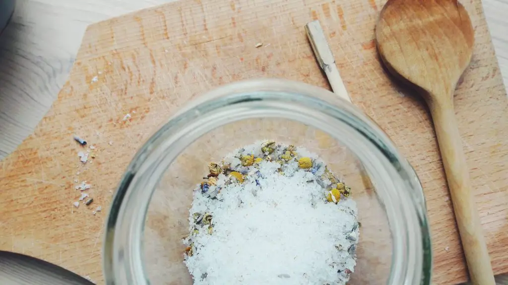 Soothing homemade sea salt bath for tired feet with dried flowers and essential oils